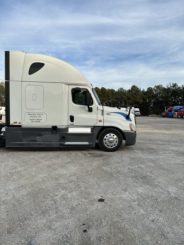 2017 Freightliner Cascadia 125 with 2003 Mack End Dump Trailer